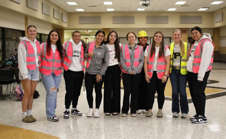 LADY LOPES Post ISD varsity volleyball prepares to go to Abernathy in their construction themed jackets. | KHLOE SMITH PHOTO
