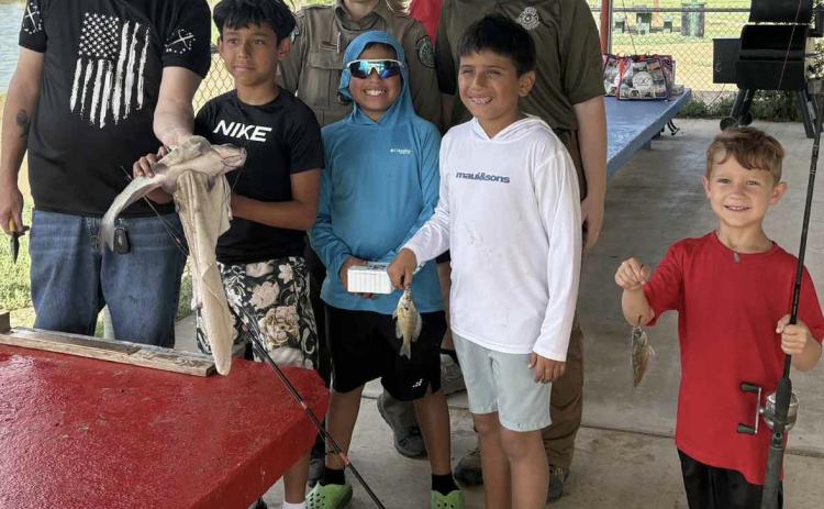 TEXAS GAME WARDENS were in attendance at the Post City Park June 13 to help youngsters with water safety and identifying fish species. MORE PHOTOS, PAGE 8 | COURTESY PHOTO