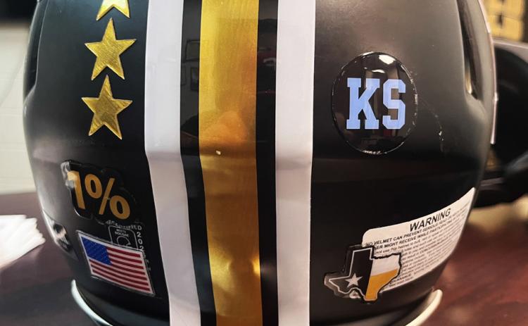 SPECIAL TRIBUTE Post Bold Gold Antelope players wore special baby blue helmet stickers bearing Kyler Smith’s initials during the Sept. 25 game against Hawley. | RUSS MORRIS